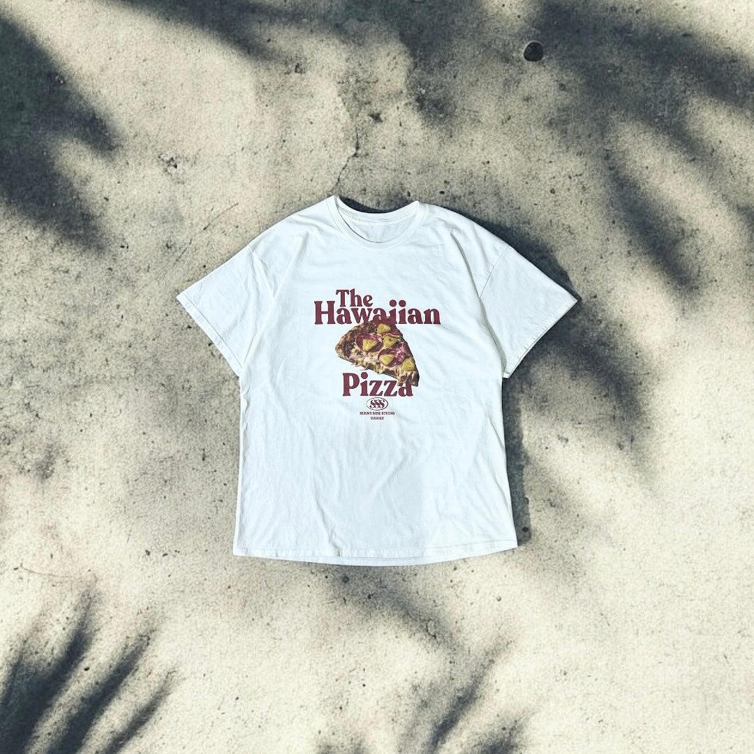 White t-shirt with 'Hawaiian Pizza' graphic on a textured surface