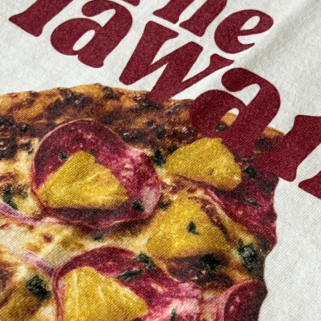 Close-up of a pizza with pineapple and pepperoni