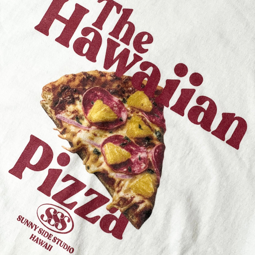 White t-shirt with a slice of Hawaiian pizza graphic and text on a white background